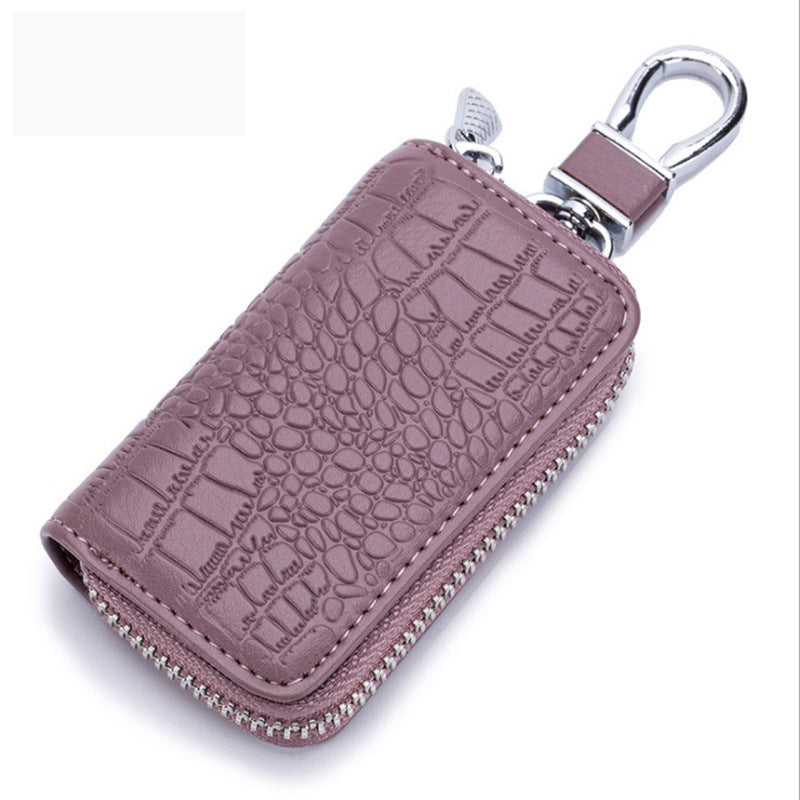 Porte-clés en cuir violet à texture crocodile avec fermeture éclair et mousqueton argenté